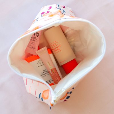 cosmetics inside a zippered pouch